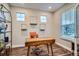 Bright office with a large window, a unique desk, and shelving that adds to the room's appeal at 9786 Rosalee Peak St, Littleton, CO 80125