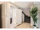 Neutral bathroom with tiled floor, shower, and staircase with tropical plant at 3020 Niagara St, Denver, CO 80207