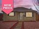 Charming brick home featuring mature landscaping, complemented by an inviting front entrance with storm door at 3020 Niagara St, Denver, CO 80207