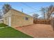 A detached garage offers extra parking space, enhanced by artificial grass and stone landscaping at 3020 Niagara St, Denver, CO 80207