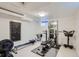 Well-equipped home gym with weights, rowing machine and chalkboard at 3020 Niagara St, Denver, CO 80207