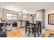 Bright kitchen features stainless appliances, wood floors and breakfast nook with seating at 3020 Niagara St, Denver, CO 80207