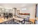 Cozy living room features a comfortable couch, modern coffee table and decorative rug at 3020 Niagara St, Denver, CO 80207