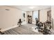 Cozy home office featuring patterned rug, large window, and a comfortable workspace at 3020 Niagara St, Denver, CO 80207
