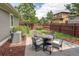 Backyard patio featuring outdoor seating and a landscaped yard at 3354 Wabash St, Denver, CO 80238