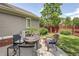 Charming patio area in backyard perfect for outdoor entertaining and relaxing on warm summer nights at 3354 Wabash St, Denver, CO 80238