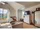 A bright room with vaulted ceilings, lots of windows and a ceiling fan at 3354 Wabash St, Denver, CO 80238