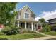 Beautiful two-story home featuring a lovely front porch and well-maintained lawn at 3354 Wabash St, Denver, CO 80238