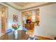 Open kitchen with granite countertops and bar stool seating overlooks the dining area with seating for four at 3354 Wabash St, Denver, CO 80238