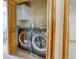 Laundry closet features a washer, dryer, and wood trim at 3354 Wabash St, Denver, CO 80238