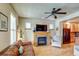 Comfortable living room featuring a fireplace, leather sofa and hardwood floors at 3354 Wabash St, Denver, CO 80238