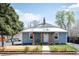 Charming single-story home featuring a covered front porch and well-maintained landscaping at 1794 Xenia St, Denver, CO 80220