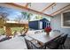 Covered patio featuring outdoor seating, a shed, and a view of the lush green lawn at 1794 Xenia St, Denver, CO 80220