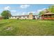 Large backyard featuring a well-maintained lawn and outdoor structure at 12734 Anhawa Ave, Longmont, CO 80503