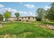 Generous backyard with green grass and trees, offering privacy at 12734 Anhawa Ave, Longmont, CO 80503