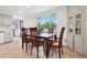 The dining area offers natural light and tile flooring at 12734 Anhawa Ave, Longmont, CO 80503