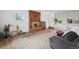 Spacious living room with brick fireplace and cozy seating area at 12734 Anhawa Ave, Longmont, CO 80503