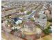 Aerial shot of the property within a neighborhood, highlighting the backyard, surrounding landscaping, and nearby streets at 11254 Oakland Dr, Commerce City, CO 80640