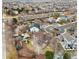 Aerial view showcases a home's backyard, patio, and convenient location within a residential neighborhood at 11254 Oakland Dr, Commerce City, CO 80640
