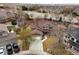 Beautiful aerial view of home with lush landscaping, and a large driveway at 11254 Oakland Dr, Commerce City, CO 80640