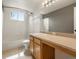 Well lit bathroom includes a bath and shower combination, vanity and mirror at 11254 Oakland Dr, Commerce City, CO 80640