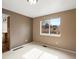 Cozy bedroom featuring neutral paint colors, carpet flooring, and a window providing natural light at 11254 Oakland Dr, Commerce City, CO 80640