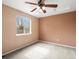 Bedroom featuring neutral carpet, a ceiling fan, and a window that provides plenty of natural light at 11254 Oakland Dr, Commerce City, CO 80640