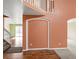 Spacious foyer with wood and carpeted flooring, arched doorway, and staircase leading to the upper level at 11254 Oakland Dr, Commerce City, CO 80640