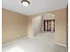 Spacious carpeted living room with a high ceiling and an arched doorway leading to another living space at 11254 Oakland Dr, Commerce City, CO 80640