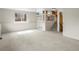 Carpeted living area with stairs and plenty of natural light at 11254 Oakland Dr, Commerce City, CO 80640