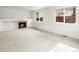 Cozy living area with a fireplace and large windows providing natural light at 11254 Oakland Dr, Commerce City, CO 80640