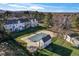Aerial view showcasing the pool, townhouses, and surrounding greenery at 3295 S Estes St, Lakewood, CO 80227