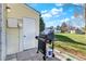 Backyard featuring a propane grill with an attached side burner next to the door at 3295 S Estes St, Lakewood, CO 80227