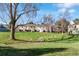 Scenic backyard with lush green lawn and natural landscaping at 3295 S Estes St, Lakewood, CO 80227