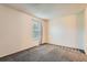 Bedroom featuring neutral walls and carpet plus a window at 3295 S Estes St, Lakewood, CO 80227