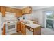 Efficient kitchen setup with white oven and dishwasher, perfect for meal prep at 3295 S Estes St, Lakewood, CO 80227