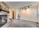 Spacious living room with a stone fireplace at 3295 S Estes St, Lakewood, CO 80227