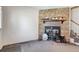Living room with a stone fireplace and carpet flooring at 3295 S Estes St, Lakewood, CO 80227