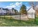 Community pool enclosed by a wrought iron fence and next to a shed at 3295 S Estes St, Lakewood, CO 80227