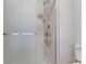 Shower with clear glass door and white tile at 3295 S Estes St, Lakewood, CO 80227
