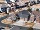 An aerial view of a residential neighborhood featuring well-maintained homes and tree-lined streets at 22647 Hopewell Ave, Parker, CO 80138