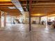 Spacious unfinished basement with exposed ceiling beams, concrete flooring, and potential for customization at 22647 Hopewell Ave, Parker, CO 80138