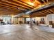 Unfinished basement with open ceiling, concrete floor, and natural light ready for customization at 22647 Hopewell Ave, Parker, CO 80138