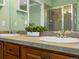 A bathroom with a double sink and a large mirror is featured at 22647 Hopewell Ave, Parker, CO 80138