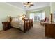 Charming bedroom featuring a ceiling fan, bay window, and natural light at 22647 Hopewell Ave, Parker, CO 80138