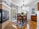 Cozy breakfast nook featuring a fireplace, sliding glass doors, hardwood floors and a decorative area rug at 22647 Hopewell Ave, Parker, CO 80138