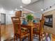 Breakfast nook featuring a fireplace, hardwood floors, and wood table with colorful place settings at 22647 Hopewell Ave, Parker, CO 80138