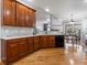 Spacious kitchen with wooden cabinets, modern appliances, tile backsplash and hardwood floors at 22647 Hopewell Ave, Parker, CO 80138