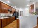 Well-lit kitchen featuring wood cabinets, modern appliances, hardwood floors and an island at 22647 Hopewell Ave, Parker, CO 80138