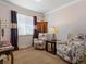 Cozy living room with floral armchairs, a window, and a side table with a lamp at 22647 Hopewell Ave, Parker, CO 80138